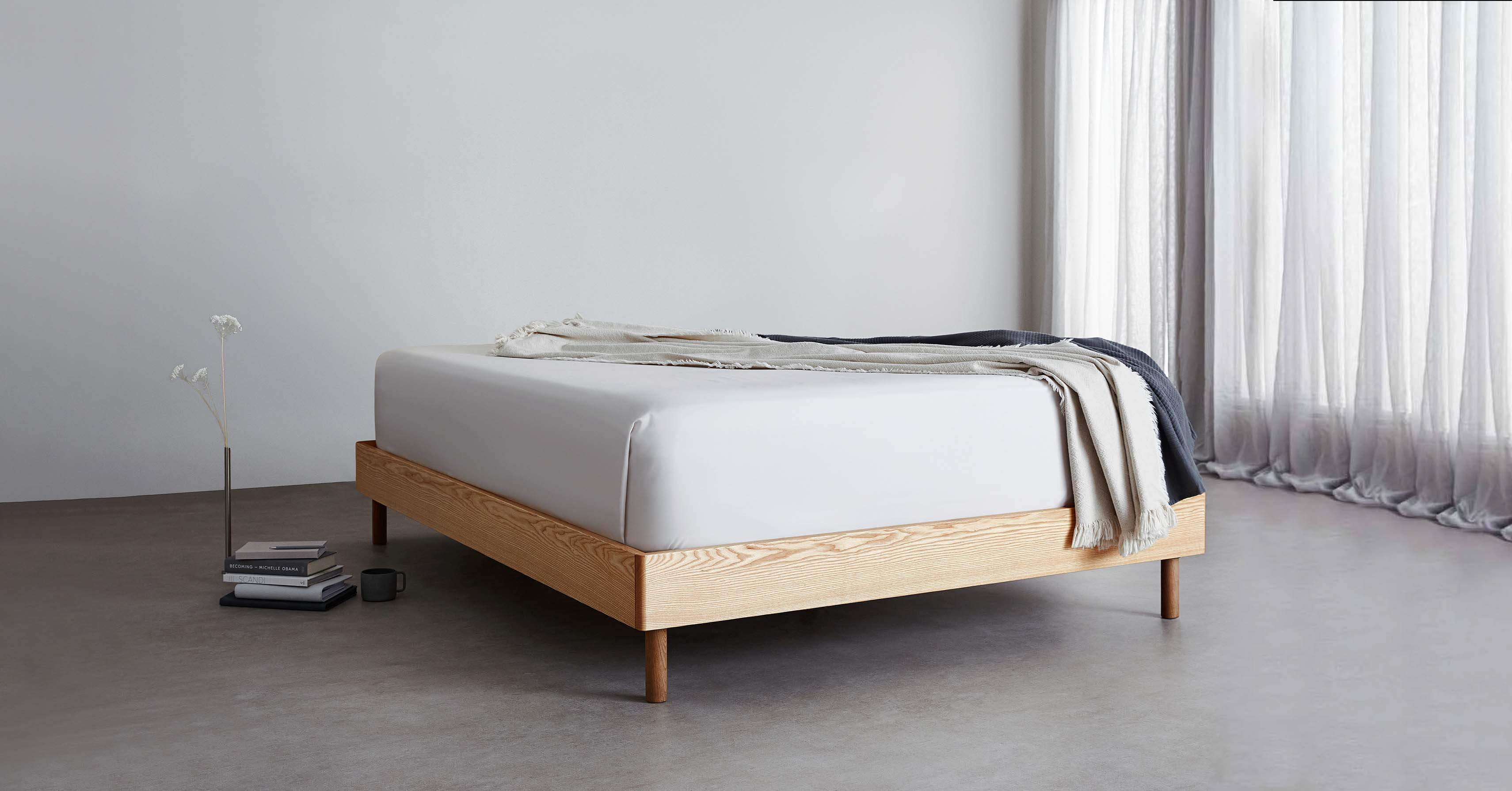 The SD Indestruct Bed Base in a minimalist bedroom setting.