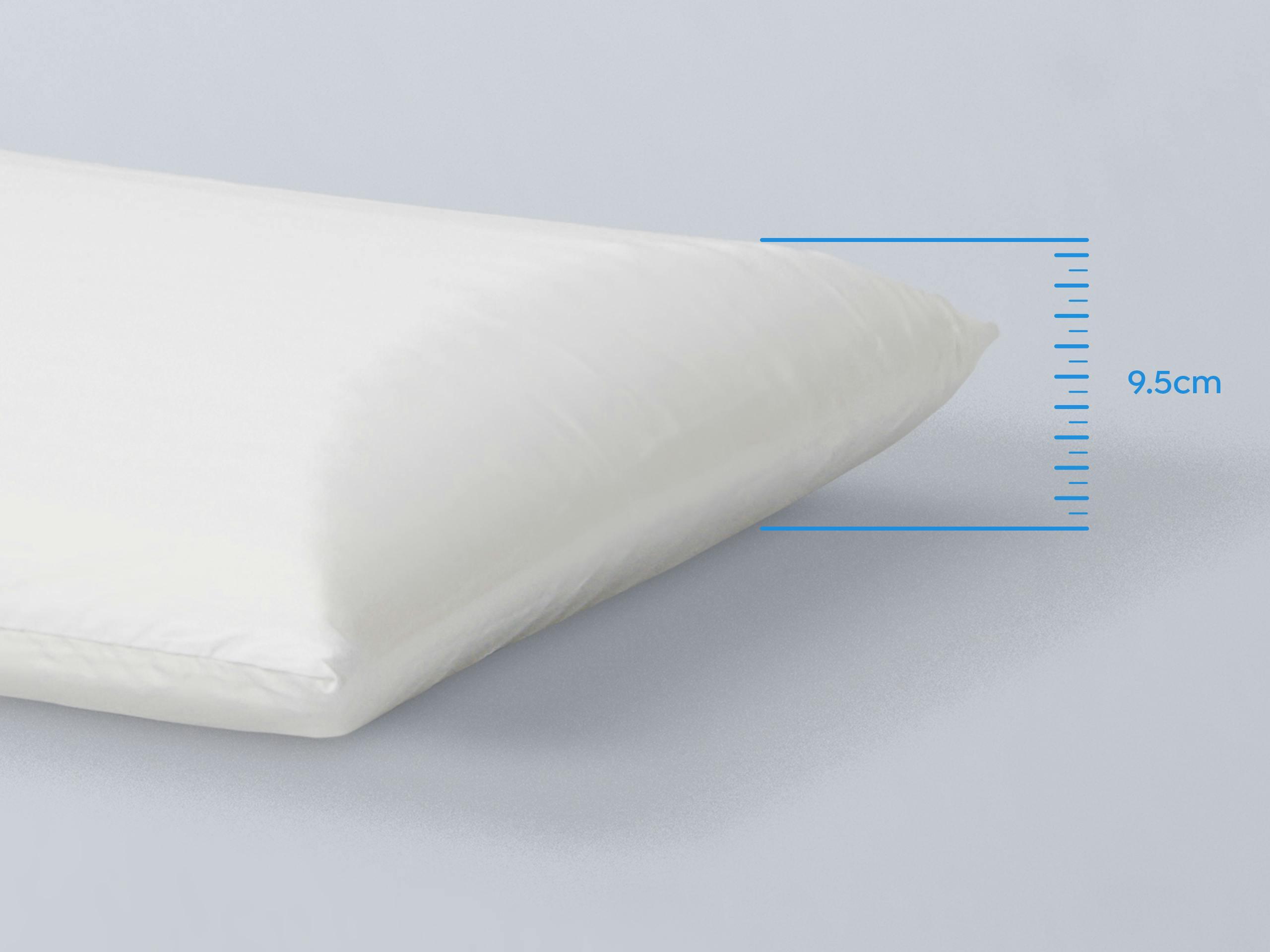 Pillow being measured as 9.5cm thick.