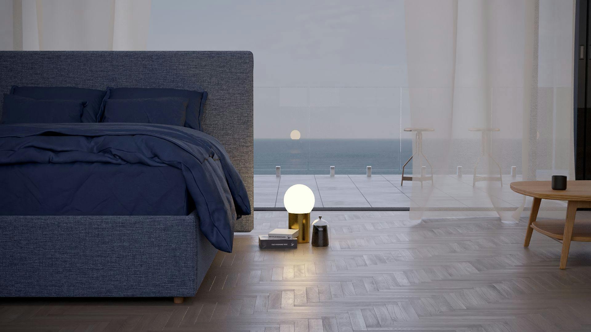 The Seaspray SD Indestruct Bed in Washed Navy, in a minimalist bedroom overlooking the ocean as the sun rises.