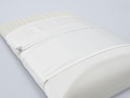 Pillow with both the pillowcase and protector case pulled back in layers, to show the AntiGravity Surface Foam.